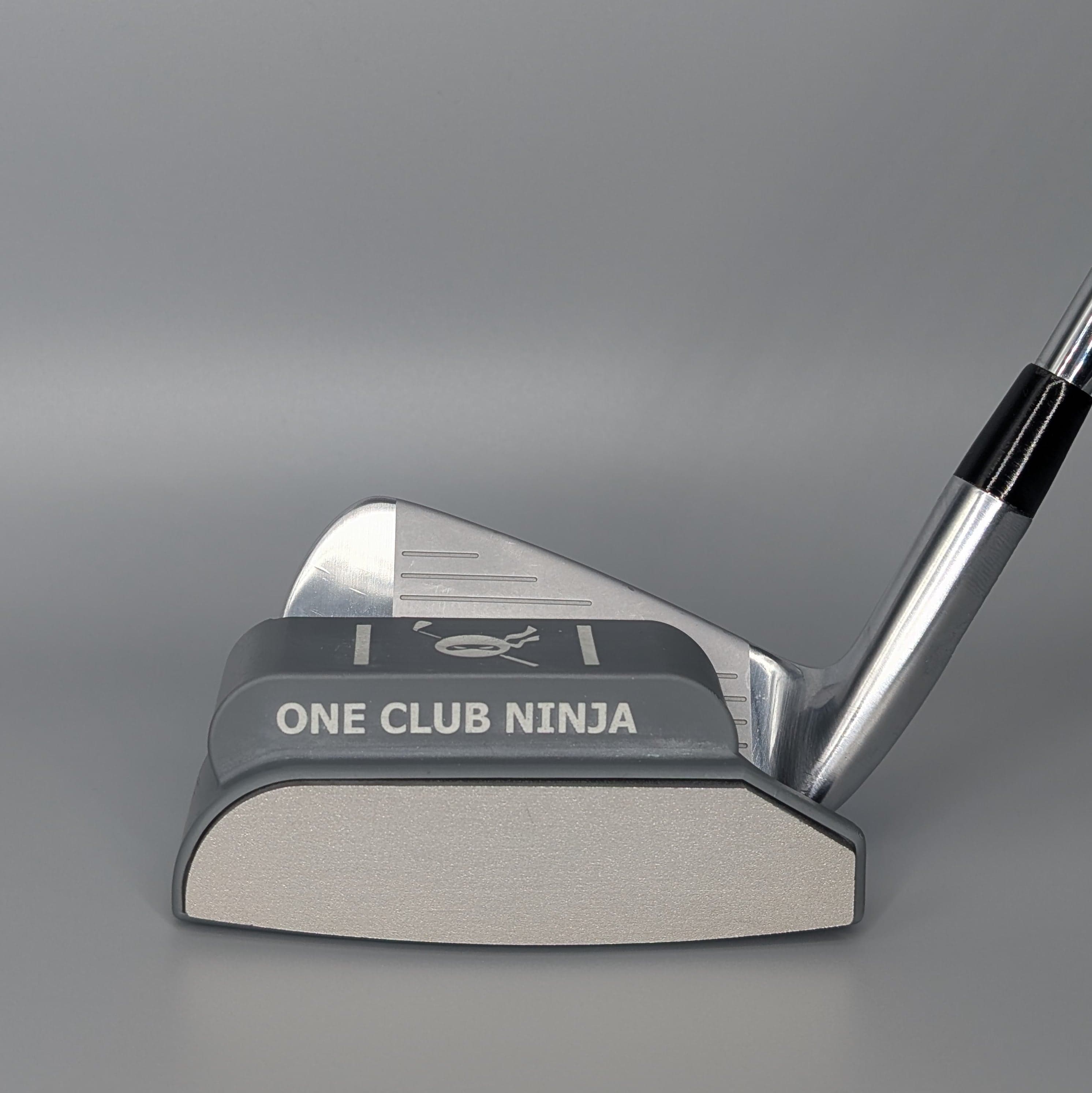 The One Club Ninja magnetic putter attachment clipped onto a 7-iron
